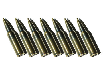 bullets lined up on a white background. isolated ammunition pattern