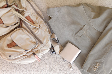 men's suit, bag, flask carelessly abandoned 
