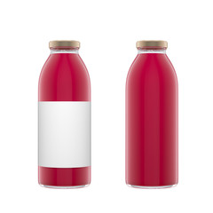 Two tall transparent glass bottles with label filled by berry juice isolated over white background.