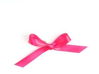 Pink satin ribbon bow on white background