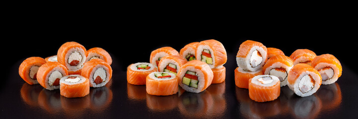 Classic sushi roll. Sushi at black background.Japanese seafood sushi , sushi a black background.