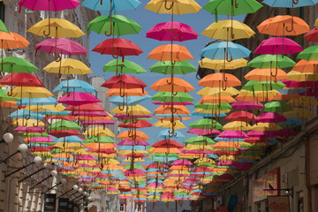 Fototapeta na wymiar Colorful umbrellas decoration in streets of Timisoara city, Romania