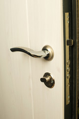 door lock closeup. steel doors. key in the door lock