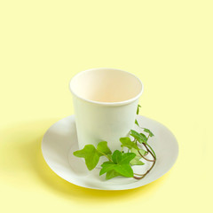 Eco-friendly disposable paper tableware with green plant branch