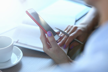 Trendy gadget in womans hands