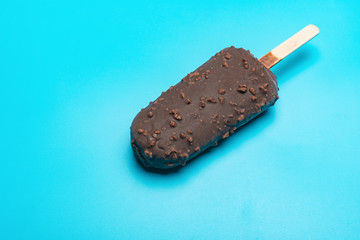 chocolate outer popsicle with beans on blue background