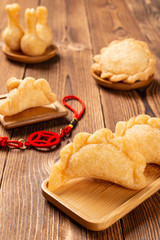 different shapes of sweet fried dumplings for Chinese New Year