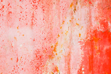 Old corroded metal wall background with flaky red paint .Rusty flaky cracked metal surface.Abstract...