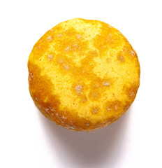 top view yellow moldy macaroon on a white background