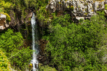 Picturesque waterfall in the basalt gorge