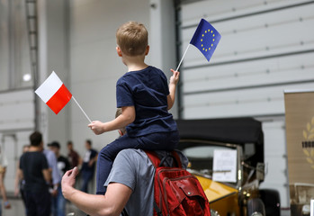 The father and the child show Poland's support for membership in the European Union before the...