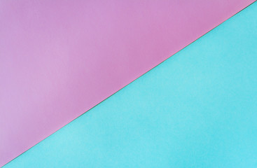 Multicolored paper background in soft blue and lilac colors.