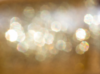 bokeh background , gold tone from a shiny golden texture