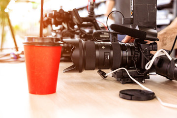 Behind the scenes of video production or video shooting. The concept of production of video content for TV, blog, shows, movies. Cameras prepared for video filming