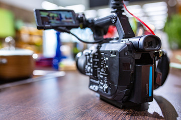 Behind the scenes of video production or video shooting. The concept of production of video content for TV, blog, shows, movies. Cameras prepared for video filming