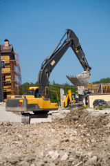 A large iron excavator at the construction site