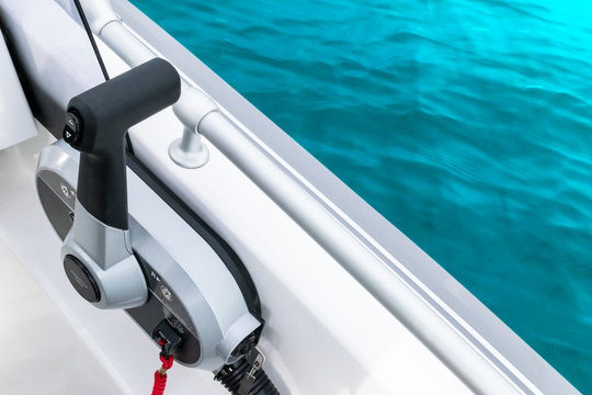 Close up throttle lever on motor boat or central gear on luxury fishing boat. Boat steering gear close up