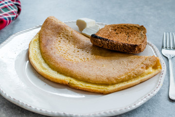 Fluffy Omelette Homemade Mont Saint Michel Style with Toast Bread and Cheese for Breakfast