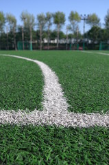 Boundery lines on artificial lawn of soccer field