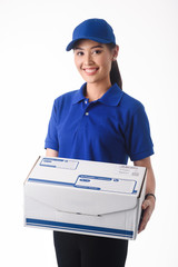 Beautiful young woman in blue uniform of delivery service, online shopping delivery concept