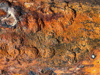 Corrosion of metal under the influence of wind, sun and salty sea water.