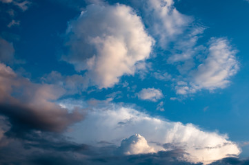Naklejka na ściany i meble Beautiful blue sky background with clouds before sunset
