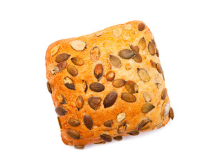 Roll with pumpkin seeds isolated on white background