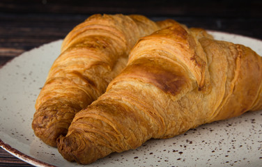 lush croissants made from gluten-free flour and butter, fresh pastries, delicious, on a wooden background