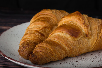 lush croissants made from gluten-free flour and butter, fresh pastries, delicious, on a wooden background