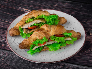lush croissants stuffed with cherry tomatoes, fresh herbs, chicken fillet in spices, gluten free flour