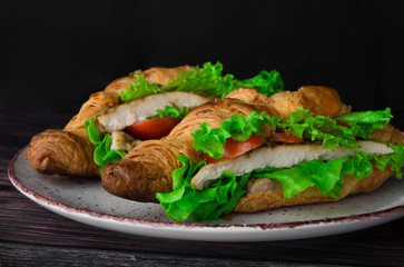 lush croissants stuffed with cherry tomatoes, fresh herbs, chicken fillet in spices, gluten free flour