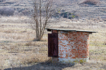 Small round lonely stone structure in the steppe