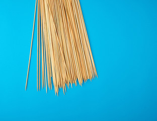 wooden bamboo chopsticks on a blue background