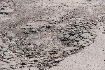 Destroyed asphalt pavement