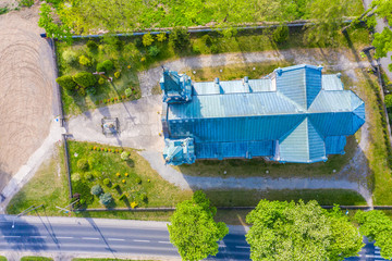 Aerial photo of a Catholic Church. Green. Spring time