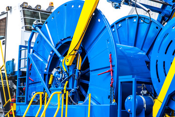 coiled tubing machine to work in the oil fields close up - obrazy, fototapety, plakaty