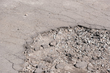 Destroyed asphalt pavement