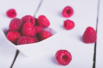 Raspberries on a bowl on a table