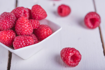 Raspberries on a bowl on a table