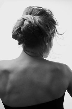 Beautiful and fashion girl with a make-up in a white jacket and a stylish haircut