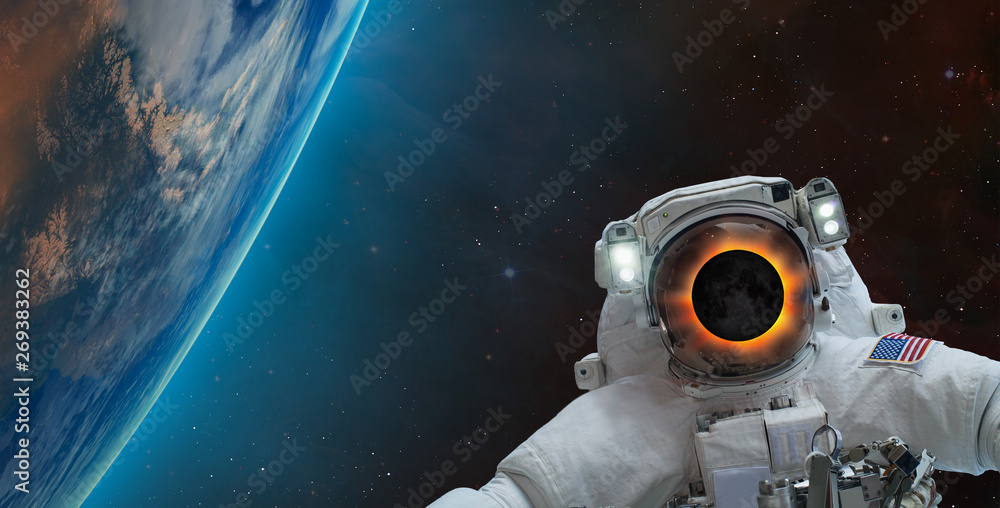 Poster Solar eclipse on the face of astronaut against spectacular blue earth 