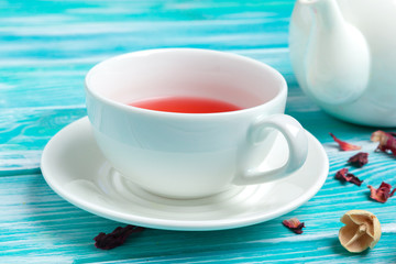 healthy herbal tea over blue background