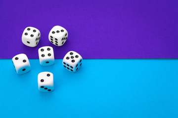 White dices against a blue background