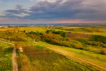 Flight over cultivating field in the spring at sunset. Moldova Republic of.