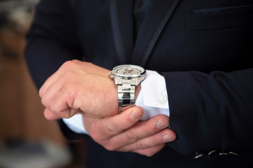 groom is checking time