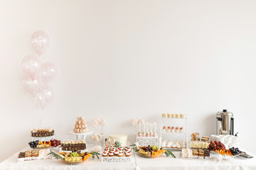 Delicious sweet buffet with cupcakes. Candy Bar.