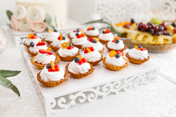 Delicious sweet buffet with cupcakes. Candy Bar.