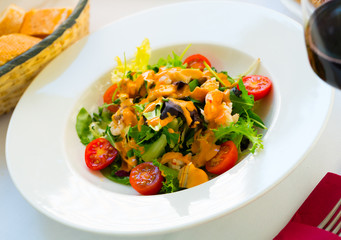 Plate of delicious salad with seafood