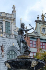 Poland .Neptune fountain at the Long Market with Artus Court in background   in Gdansk, Poland.