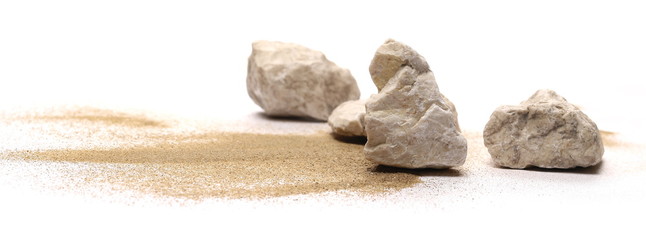 Rocks in sand pile isolated on white background and texture © dule964